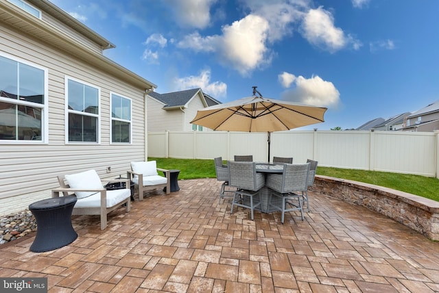 8365 Eagle St, Glen Burnie, MD 21060 - fenced backyard featuring a patio area and outdoor dining space