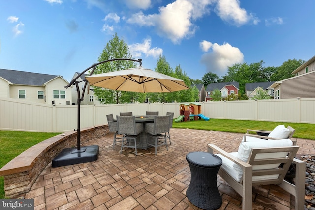 8365 Eagle St, Glen Burnie, MD 21060 - view of patio with a playground, outdoor dining space, and a residential view