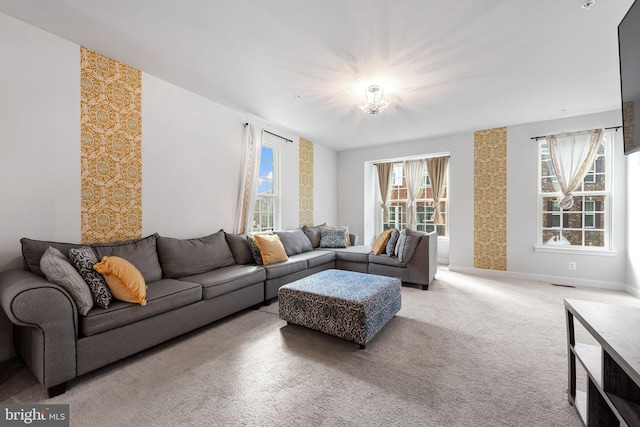9912 Vista Pointe Dr, Upper Marlboro, MD 20774 - carpeted living area featuring baseboards, visible vents, a notable chandelier, and wallpapered walls