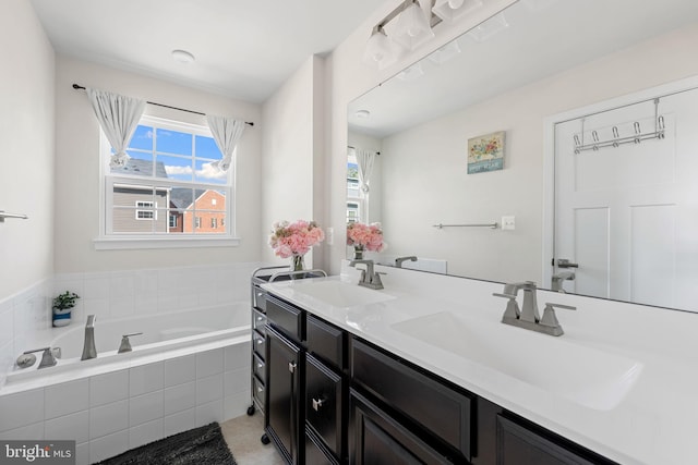 9912 Vista Pointe Dr, Upper Marlboro, MD 20774 - full bath featuring a sink, a garden tub, double vanity, and a wealth of natural light