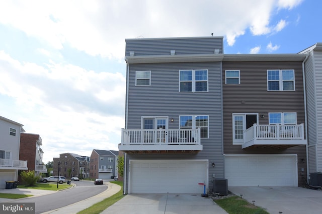 9912 Vista Pointe Dr, Upper Marlboro, MD 20774 - view of front facade with a garage, driveway, central AC, and a residential view