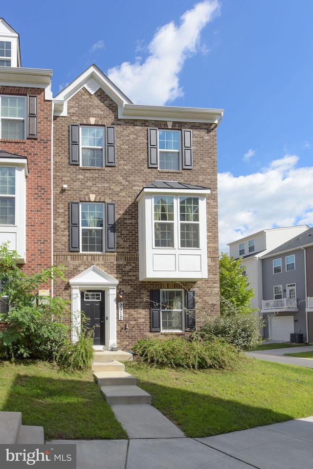 9912 Vista Pointe Dr, Upper Marlboro, MD 20774 - view of property with a front lawn and brick siding
