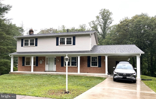 8817 Bridle Wood Dr, Springfield, VA 22152 - view of front of home with driveway, a chimney, brick siding, and a front lawn