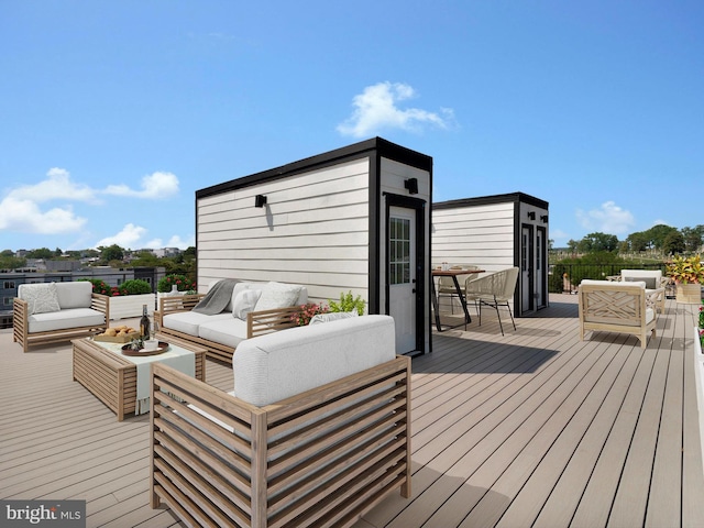 wooden terrace with outdoor lounge area