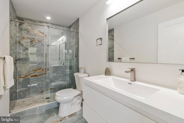 bathroom featuring toilet, a stall shower, recessed lighting, and vanity