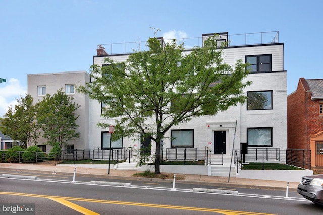 view of front of property featuring brick siding