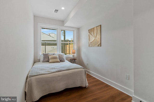 bedroom with recessed lighting, baseboards, dark wood finished floors, and visible vents