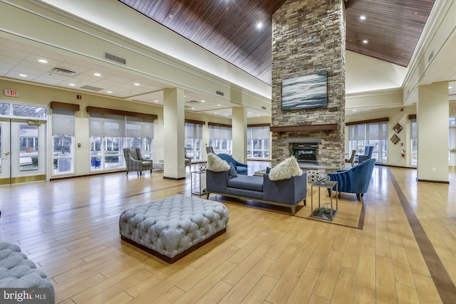 lobby featuring high vaulted ceiling, wood ceiling, and recessed lighting
