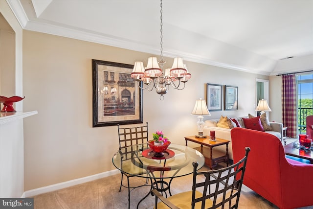 dining room featuring a chandelier, baseboards, vaulted ceiling, ornamental molding, and carpet flooring