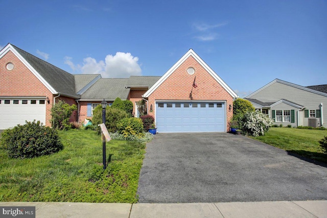 169 Lantern Ln, Chambersburg, PA 17201 - view of front facade featuring brick siding, an attached garage, and a front lawn