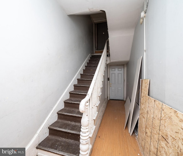 stairs with wood finished floors
