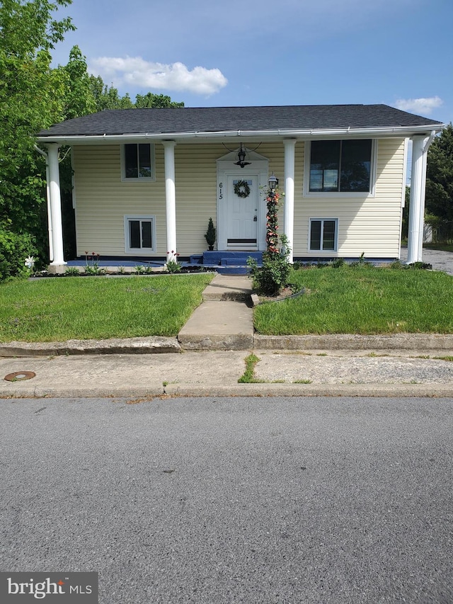 view of front of house featuring a porch and a front yard