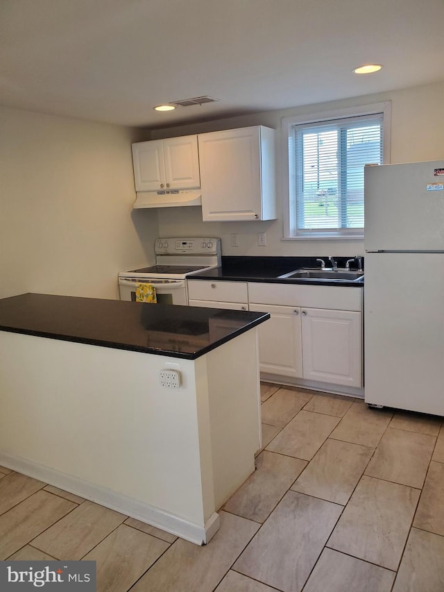 kitchen featuring visible vents, white appliances, under cabinet range hood, white cabinets, and a sink
