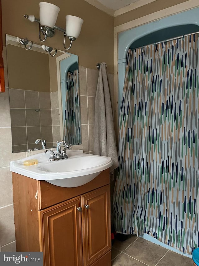217 Federal St, Lebanon, PA 17042 - bathroom with vanity, tile walls, tile patterned flooring, a shower with shower curtain, and decorative backsplash