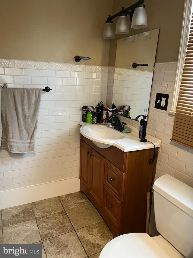 217 Federal St, Lebanon, PA 17042 - bathroom featuring tile walls, vanity, and toilet