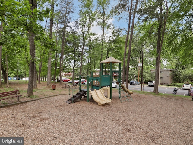 communal playground with view of wooded area