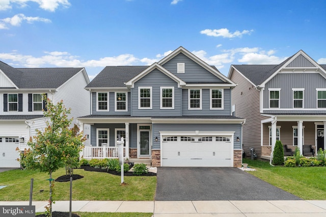 3150 Dodder Way, Odenton, MD 21113 - view of front of house with a porch, driveway, a front lawn, and a garage