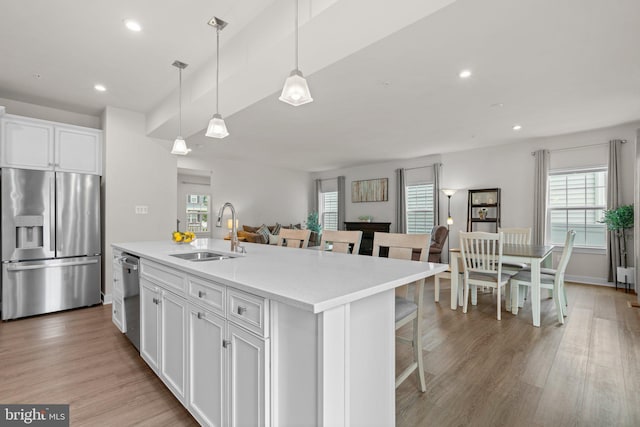3150 Dodder Way, Odenton, MD 21113 - kitchen featuring appliances with stainless steel finishes, a sink, white cabinets, a kitchen island with sink, and recessed lighting