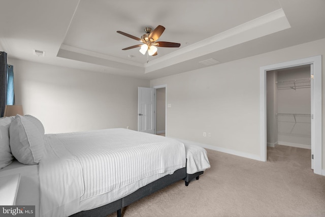 3150 Dodder Way, Odenton, MD 21113 - carpeted bedroom with a tray ceiling, baseboards, a spacious closet, and a ceiling fan