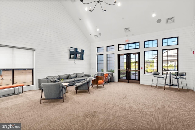 3150 Dodder Way, Odenton, MD 21113 - carpeted living area with high vaulted ceiling, french doors, and a chandelier