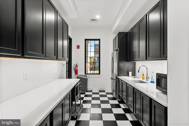 3150 Dodder Way, Odenton, MD 21113 - laundry room with a sink, dark flooring, and baseboards