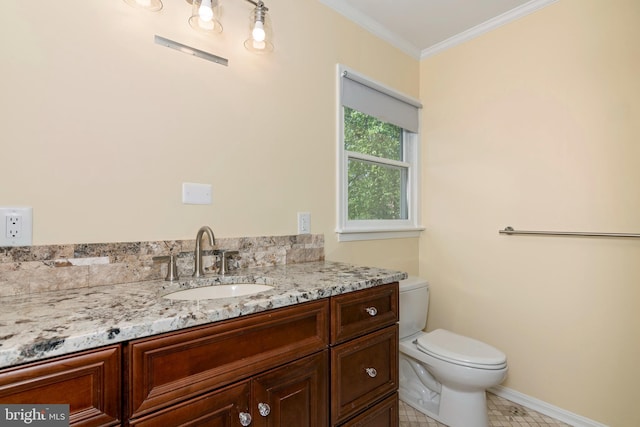 half bathroom featuring toilet, baseboards, tile patterned flooring, vanity, and crown molding