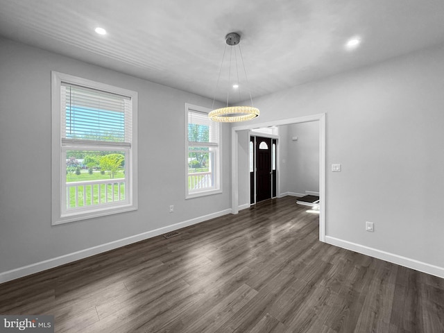 77 Iris Way, Charles Town, WV 25414 - unfurnished dining area with dark wood-type flooring, baseboards, and recessed lighting