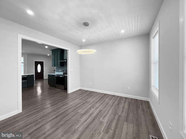 77 Iris Way, Charles Town, WV 25414 - unfurnished living room featuring dark wood finished floors, recessed lighting, healthy amount of natural light, and baseboards