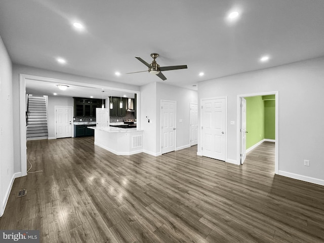 77 Iris Way, Charles Town, WV 25414 - unfurnished living room featuring stairway, ceiling fan, baseboards, recessed lighting, and dark wood-style floors