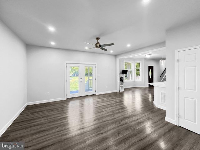 77 Iris Way, Charles Town, WV 25414 - unfurnished living room with ceiling fan, recessed lighting, dark wood-type flooring, baseboards, and french doors