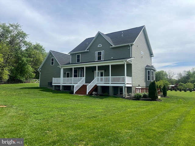 77 Iris Way, Charles Town, WV 25414 - back of house with covered porch, a yard, and a shingled roof