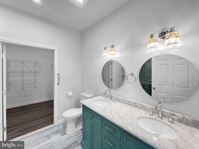 77 Iris Way, Charles Town, WV 25414 - full bath with toilet, double vanity, and baseboards