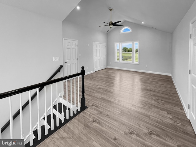 77 Iris Way, Charles Town, WV 25414 - empty room with a ceiling fan, wood finished floors, baseboards, high vaulted ceiling, and recessed lighting