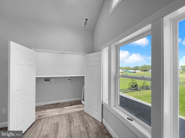 77 Iris Way, Charles Town, WV 25414 - laundry area with electric dryer hookup, hookup for a washing machine, wood finished floors, and baseboards