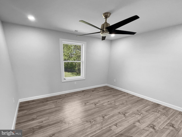 77 Iris Way, Charles Town, WV 25414 - empty room featuring ceiling fan, wood finished floors, baseboards, and recessed lighting