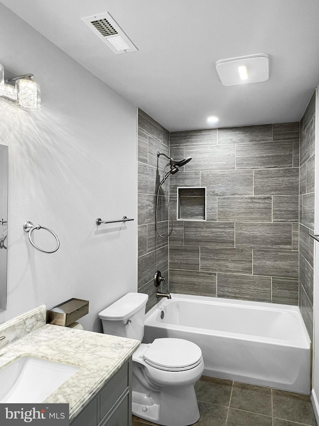 77 Iris Way, Charles Town, WV 25414 - full bathroom with tile patterned floors, toilet,  shower combination, and vanity