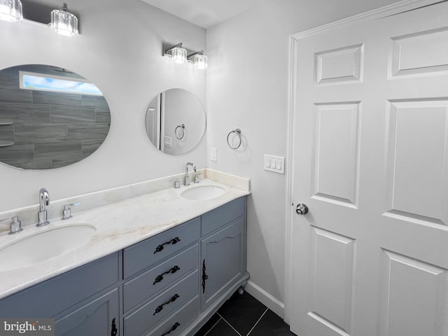 77 Iris Way, Charles Town, WV 25414 - bathroom featuring tile patterned floors, double vanity, and baseboards