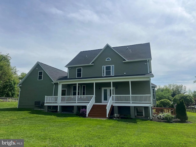 77 Iris Way, Charles Town, WV 25414 - rear view of property featuring central air condition unit, a lawn, covered porch, and roof with shingles