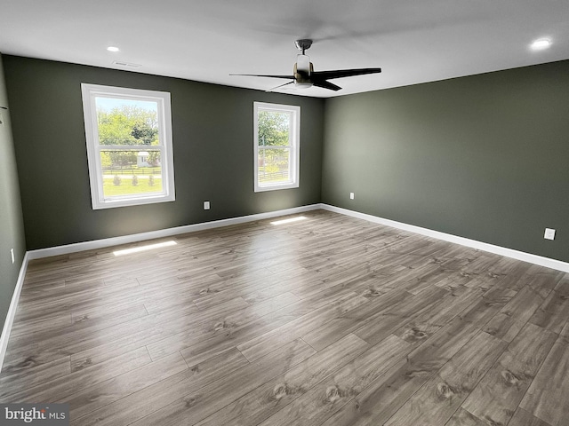 77 Iris Way, Charles Town, WV 25414 - spare room featuring healthy amount of natural light, a ceiling fan, and wood finished floors