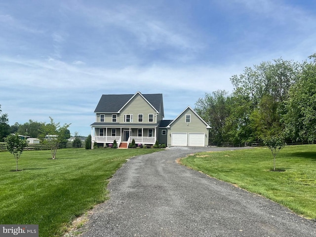 77 Iris Way, Charles Town, WV 25414 - view of front facade with a porch, asphalt driveway, and a front yard