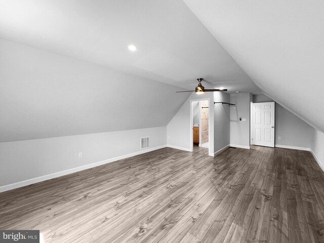 77 Iris Way, Charles Town, WV 25414 - bonus room with dark wood-style floors, lofted ceiling, baseboards, and ceiling fan