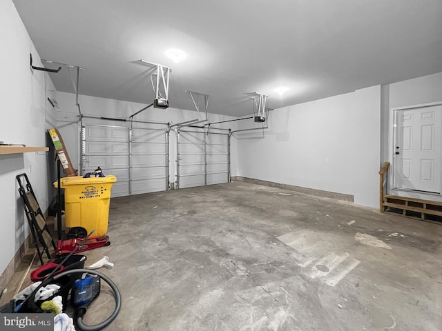 77 Iris Way, Charles Town, WV 25414 - garage with a garage door opener and baseboards
