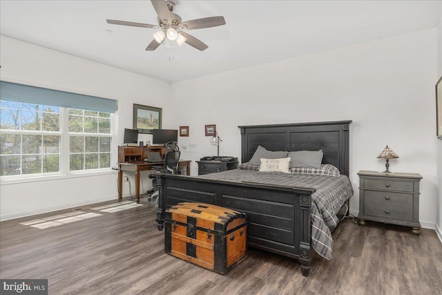 bedroom with baseboards, ceiling fan, and wood finished floors