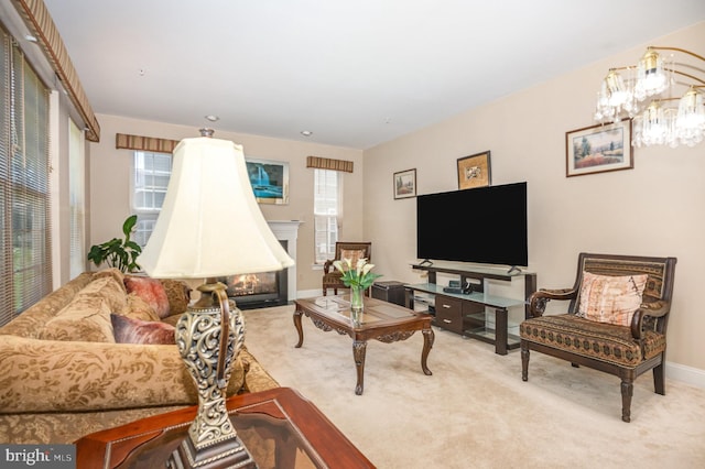 12216 Hillantrae Dr, Clinton, MD 20735 - carpeted living area with plenty of natural light, a fireplace with flush hearth, a chandelier, and baseboards