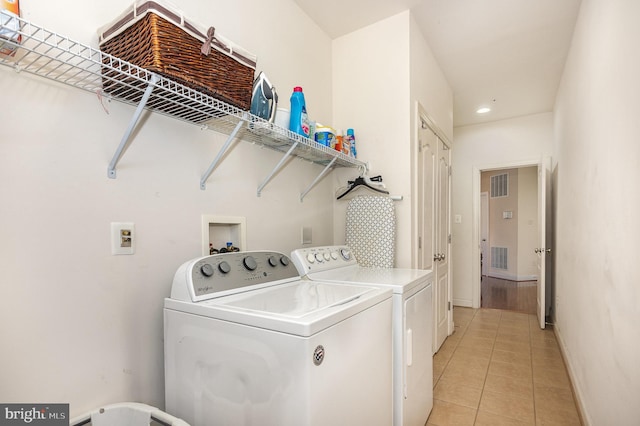 12216 Hillantrae Dr, Clinton, MD 20735 - washroom featuring washing machine and dryer, light tile patterned floors, baseboards, and recessed lighting