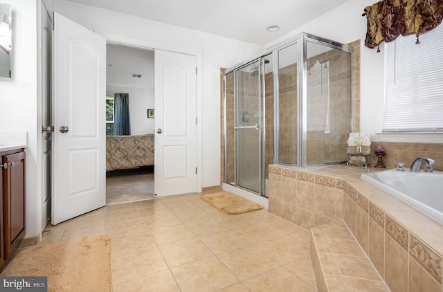 12216 Hillantrae Dr, Clinton, MD 20735 - ensuite bathroom with tile patterned flooring, a garden tub, a shower stall, and vanity