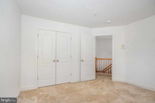 12216 Hillantrae Dr, Clinton, MD 20735 - unfurnished bedroom featuring light colored carpet, baseboards, and a closet