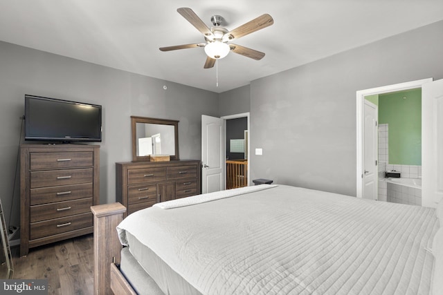 bedroom featuring dark wood-style flooring, connected bathroom, and a ceiling fan