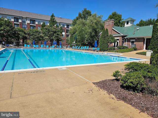 community pool with a patio