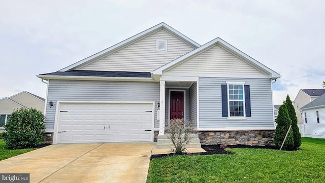 view of front of property with a garage, driveway, stone siding, and a front lawn